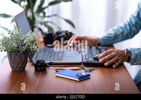 Closeup external hard drive on wooden desktop. Working with external hard drive. Stock Photo