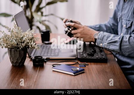 Closeup external hard drive on wooden desktop. Working with external hard drive. Stock Photo