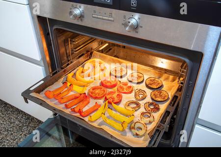Vegetables have been roasted in an oven. Stock Photo