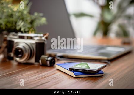 Closeup external hard drive on wooden desktop. Working with external hard drive. Stock Photo