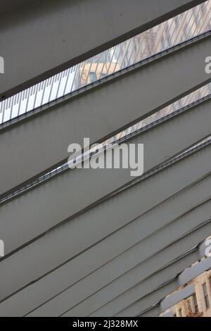 Decorative steel beams constructing the roof of the local downtown train platform. Stock Photo