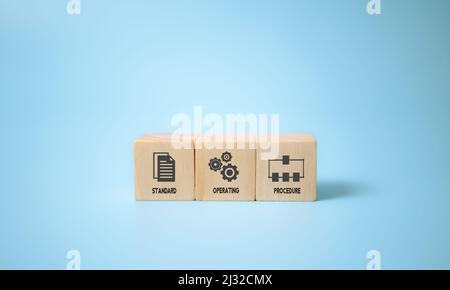 Standard Operating Procedure - SOP business concept. Instructions to assist employees in complex routine operations. The wooden cubes with "Standard O Stock Photo
