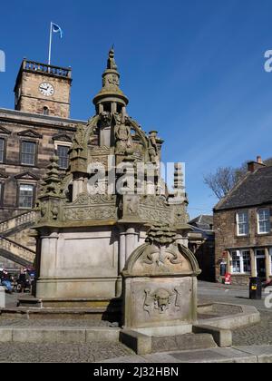 The Cross Well in front of the Burgh Hall, Linlithgow, West Lothian, Scotland, UK Stock Photo