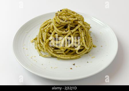 basil pesto pasta on a white background Stock Photo