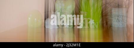 Banner with different Easter decorations created by a blur effect. The text on the sign is German for Easter. Stock Photo