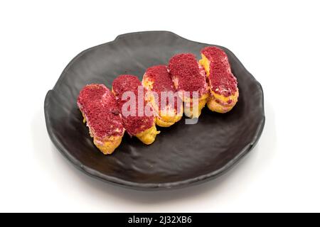 Raspberry eclair cake isolated on white background. World cuisine delicacies. close up Stock Photo