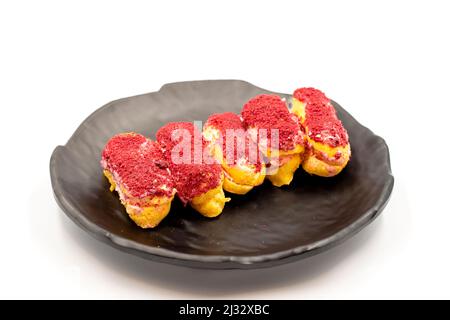 Raspberry eclair cake isolated on white background. World cuisine delicacies. close up Stock Photo