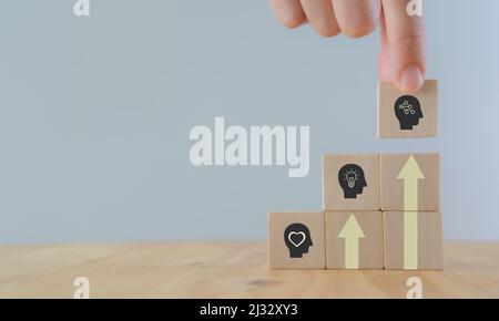 Skills development concept. New skills for technology evolution. Soft, thinking,digital skill. Hand holds wooden cubes with digital skill icon on whit Stock Photo