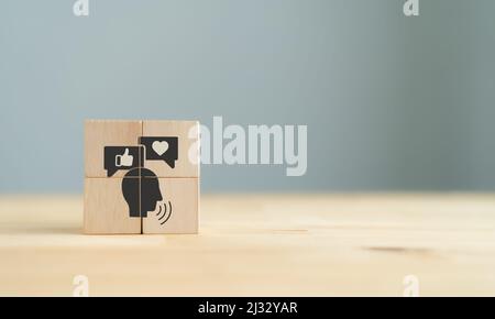 Key opinion leader (KOL) marketing concept. New social media influencer marketing in digital age. Hand holds wooden cube with KOL icon on the wooden t Stock Photo