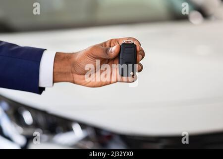 Auto Sale Concept. Closeup Of Car Keys In African American Man Hand Stock Photo