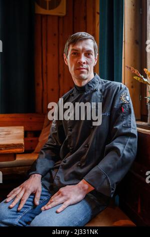 Dipperz, Germany. 05th Apr, 2022. Vitaly (38) from Kiev helps in the kitchen with the Glas family. He arrived in Germany on March 17, together with his family, after fleeing from Kiev. He wants to work as a cook in the kitchen of the grill restaurant Kneshecke. To do so, he needs a social security number and a residence permit, which he applied for today. If the application is approved, he can work as a cook. Credit: Daniel Vogl/dpa/Alamy Live News Stock Photo