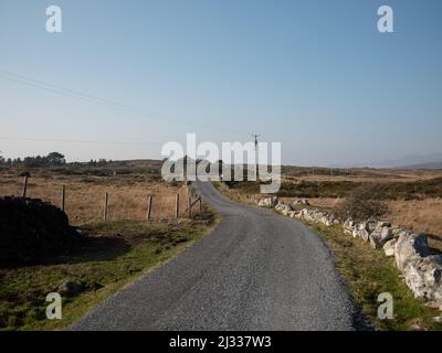 A road in Connemara, County Galway, Ireland. Stock Photo