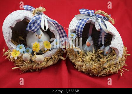 Easter decorations. Easter eggs. Coloured eggs. Decorated eggs. Eggshell with chicken inside. Resurrection celebration. Spring event. Religious. Stock Photo