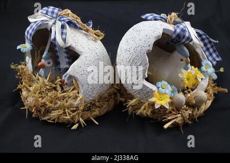 Easter decorations. Easter eggs. Coloured eggs. Decorated eggs. Eggshell with chicken inside. Resurrection celebration. Spring event. Religious. Stock Photo