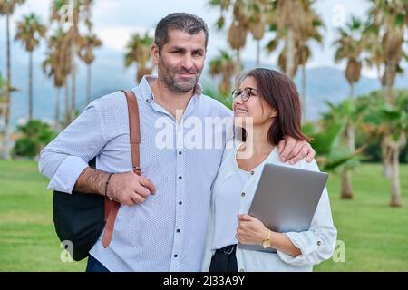 Portrait of mature couple, smiling man and woman looking at camera Stock Photo