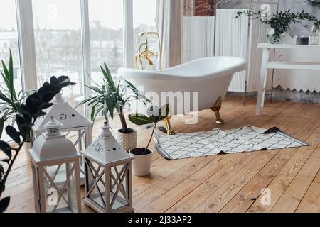 Bathing Room Interior Design. Cozy Empty Modern Bathroom Background With White Bathtub Stock Photo