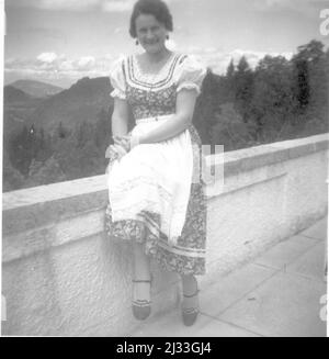 Anf dem Berghof Pfingsten 1935. Eva Braun's Photo Albums, ca. 1913 - ca. 1944. These albums are attributed to Eva Braun (four are claimed by her friend Herta Schneider, nee Ostermeyer) and document her life from ca. 1913 to 1944. There are many photographs of Eva, her sisters and their children, Herta Schneider and her children, as well as photographs of Eva's vacations, family members and friends. Included also are photographs taken by and of Eva Braun at Hitler's chalet Berghof (or Kehlstein), photographs of Hitler and his entourage, visitors to Berghof and the scenery around Berchtesgaden, Stock Photo