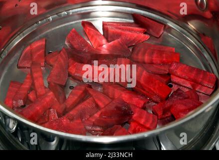 Beets cut in steaming pan Stock Photo
