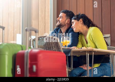 Young tourist couple having breakfast in a hotel Stock Photo