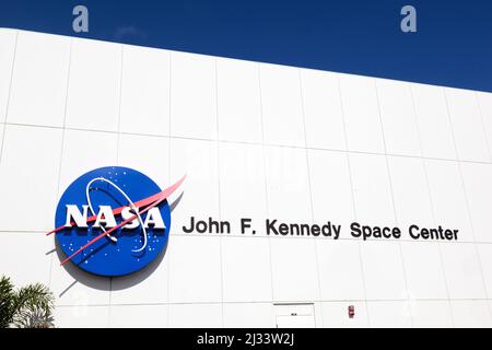 ORLANDO, USA - JULY 25, 2011: facade of main entrance for tourists with John F. Kennedy Space Center and NASA emblem in Orlando. Stock Photo