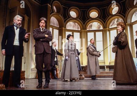 l-r: Frank Finlay (Lopakhin), David Battley (Yepihodov), Bill Fraser (Simeonov-Pischik - rear), Margaret Robertson (Charlotta Ivanovna), Leslie Phillips (Gayev), Joan Plowright (Madame Ranevskaya) in THE CHERRY ORCHARD by Chekhov at the Theatre Royal Haymarket, London SW1  18/10/1983  set design: Kenneth Mellor  costumes: Mark Negin  lighting: Andy Phillips  director: Lindsay Anderson Stock Photo