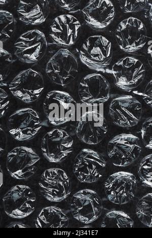 Packing bubble wrap for parcels on a Black background in full screen Stock Photo