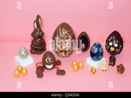 Chocolate Easter eggs on a pink background. Stock Photo
