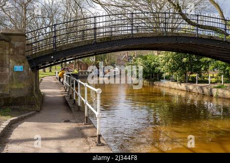 cobbled foot bridge over the bridgewater canal Worsley Stock Photo