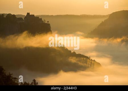 View from Eichfelsen to Werenwag Castle with morning fog, sunrise, near Irndorf, Obere Donau Nature Park, Upper Danube Valley, Danube, Swabian Alb, Baden-Württemberg, Germany Stock Photo