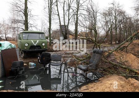 HOSTOMIL, UKRAINE - Apr. 02, 2022: Broken tanks, combat vehicles and other burnt military equipment of the Russian invaders in Hostomil, Kiev region Stock Photo