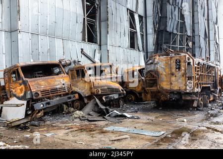 HOSTOMIL, UKRAINE - Apr. 02, 2022: Broken tanks, combat vehicles and other burnt military equipment of the Russian invaders in Hostomil, Kiev region Stock Photo