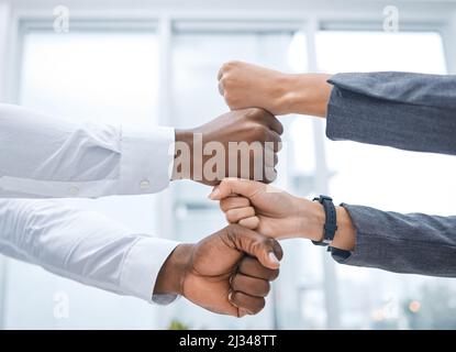 Im confident that well succeed. Shot of two businesspeople stacking their fists on top of each other. Stock Photo