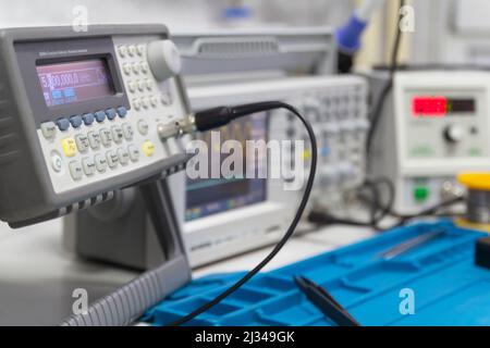 Power supplies and electronic measuring devices in the laboratory.Electronic measuring instruments in science lab. Stock Photo