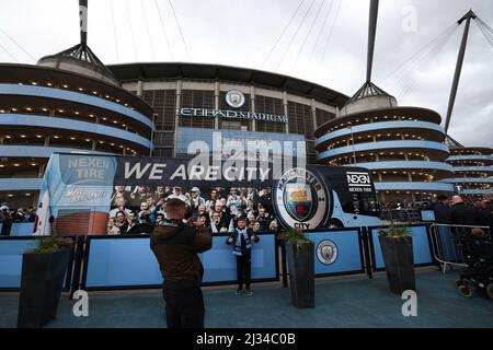Manchester, England, 5th April 2022.  Fans pose for photographs before the UEFA Champions League match at the Etihad Stadium, Manchester. Picture credit should read: Darren Staples / Sportimage Stock Photo
