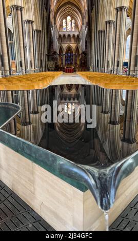 the water font with reflection of the Nave, Quire and Trinity Chapel at Salisbury Cathedral, England. Stock Photo