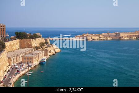 Valletta landscape with Ricasoli East Breakwater and Grand Harbour. Malta Stock Photo