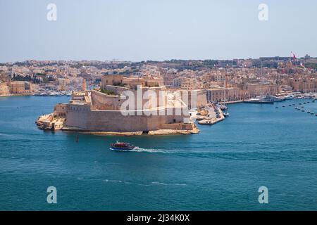 Landscape of Valletta, Malta. Fort St. Angelo, a bastioned fort in Birgu, Malta. It was originally built in the medieval period Stock Photo