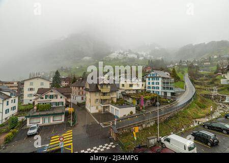 Gersau town in central Switzerland in cold snowy spring evening Stock Photo