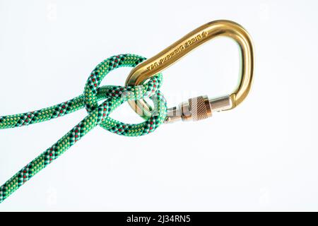 Clove hitch on locking screwgate locking carabiner Stock Photo