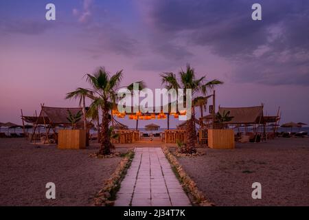 Beach bar on the shore of Agiokampos beach, Aegean sea Stock Photo