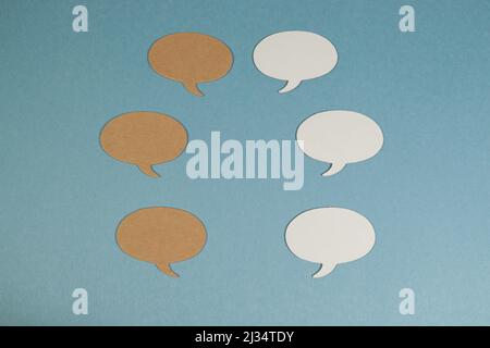Oval Speech bubbles against blue background with copy space Stock Photo
