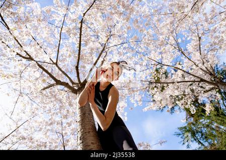 Teenage Female Dancer Under Cherry Trees at UC Berkeley Stock Photo