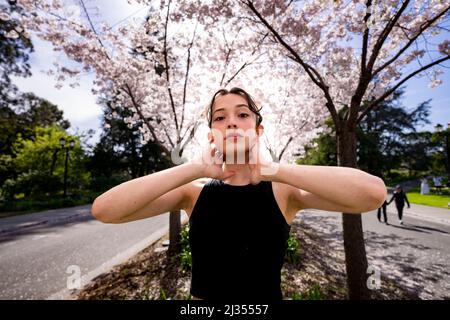 Teenage Female Dancer Under Cherry Trees at UC Berkeley Stock Photo