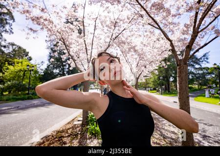 Teenage Female Dancer Under Cherry Trees at UC Berkeley Stock Photo