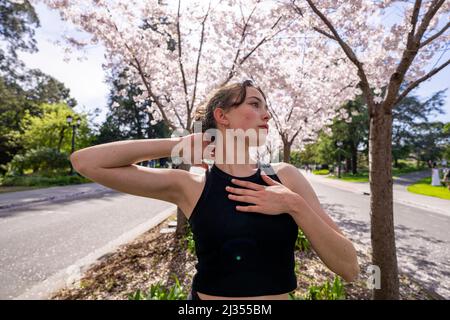 Teenage Female Dancer Under Cherry Trees at UC Berkeley Stock Photo