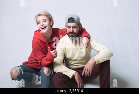 Feeling free and stylish. Man and woman wear modern clothes for youth generation. Forever young. Couple hang out together. Carefree people. Youth just Stock Photo