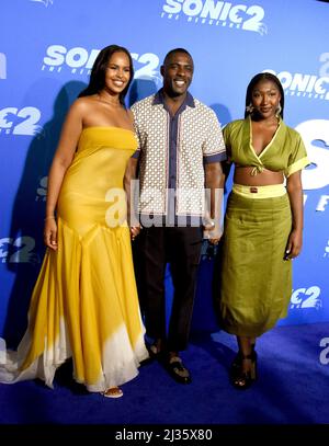 Los Angeles, California, USA 5th April 2022 (L-R) Sabrina Dhowre, Actor Idris Elba and daughter Isan Elba attend Paramount Pictures LA Premiere of 'Sonic 2: The Hedgehog' at Regency Village Theatre on April 5, 2022 in Los Angeles, California, USA. Photo by Barry King/Alamy Live News Stock Photo
