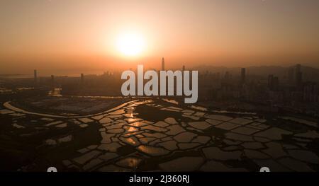 Shenzhen skyline view from the boundary of Hong Kong fish farm Stock Photo