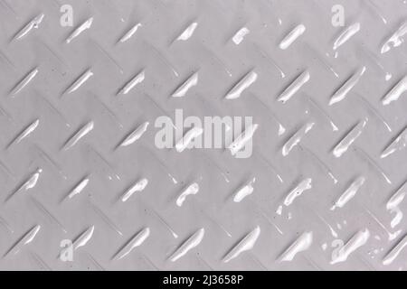 Background, texture of metal with diamond shaped pattern, painted with gray paint Stock Photo