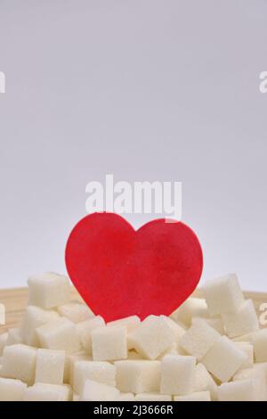 Refined sugar in a wooden plate on a white background Stock Photo - Alamy